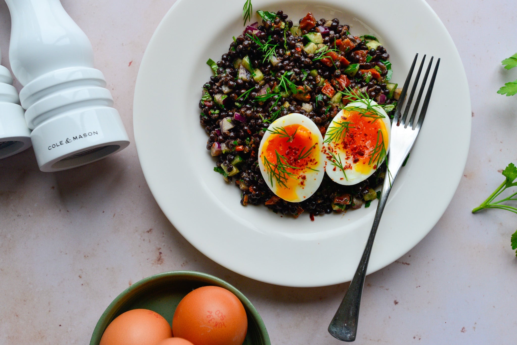 Herby beluga lentil salad with boiled egg