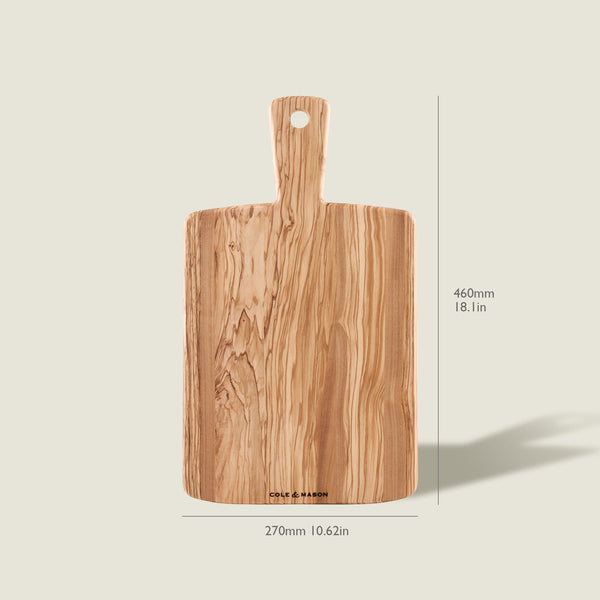 The Cole & Mason Portobello Olive Wood Serving Board is a rectangular Italian cheese or antipasti board with a handle, measuring 460mm x 270mm. It features a stunning natural wood grain pattern.