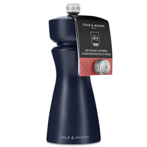 A Persian Blue salt and pepper mill from Cole & Mason’s Kenton collection, featuring a silver top and label, stands upright against a white background. Designed for versatile use, this grinder has a ceramic mechanism with adjustable grind settings.