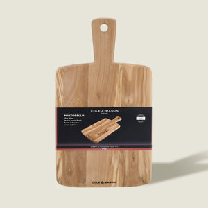 A rectangular olive wood serving board with a handle, made by Cole & Mason. Labeled "Portobello Olive Wood Serving Boards," it features a black band with product info and an image of the antipasti board.