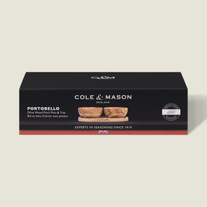 Black rectangular Cole & Mason box labeled Portobello Olive Wood Pinch Pot Set, showing unique grain olive wood pots with a seasoning tray, product image on front, and the text "Experts in Seasoning Since 1919.