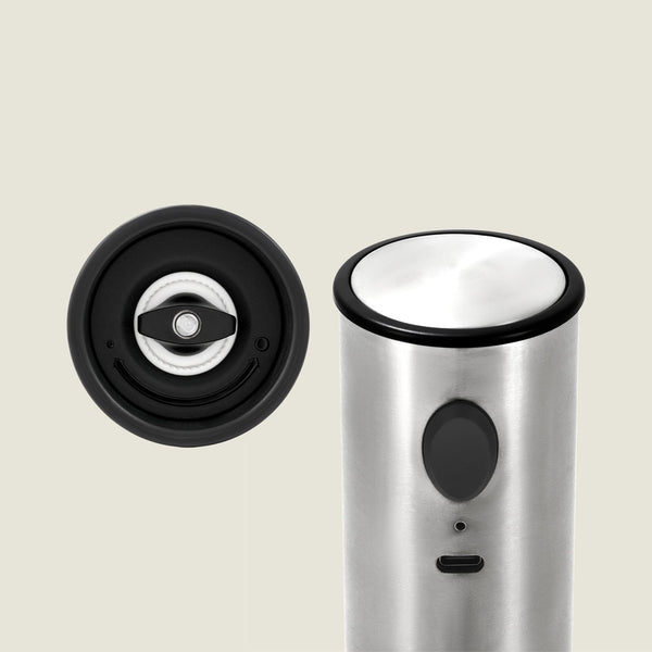The Cole & Mason Battersea USB Electric Salt & Pepper Mill stands upright on the right, while a close-up of its ceramic grinding mechanism appears on the left, both set against a plain light background.