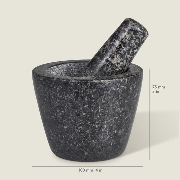 The Cole & Mason Dorchester Granite Pestle & Mortar is shown on a light background, with the mortar measuring 100 mm (4 in) wide and 75 mm (3 in) tall—perfect for grinding herbs and making fresh spice blends.