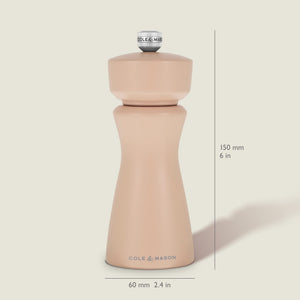 The Kenton Salt & Pepper Mill in Himalayan Salt by Cole & Mason stands upright, measuring 150 mm (6 in) tall and 60 mm (2.4 in) wide. This grinder showcases a smooth, curvy design with a silver knob on top and features a durable ceramic grinding mechanism—ideal for use as a Himalayan salt mill or pepper grinder.
