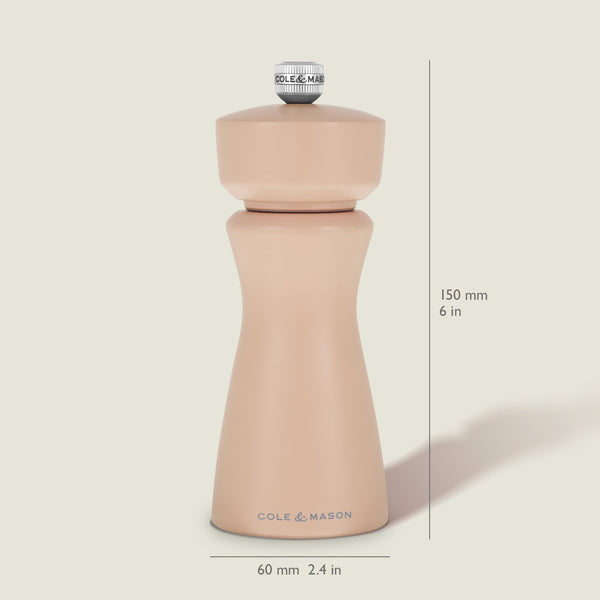 The Kenton Salt & Pepper Mill in Himalayan Salt by Cole & Mason stands upright, measuring 150 mm (6 in) tall and 60 mm (2.4 in) wide. This grinder showcases a smooth, curvy design with a silver knob on top and features a durable ceramic grinding mechanism—ideal for use as a Himalayan salt mill or pepper grinder.