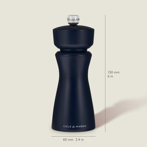 A Persian Blue Cole & Mason Kenton Salt & Pepper Mill stands upright, featuring a durable ceramic grinder for consistent performance. Text indicates its height is 150 mm (6 in) and its width is 60 mm (2.4 in). The light beige background accentuates the classic design of this salt and pepper mill.