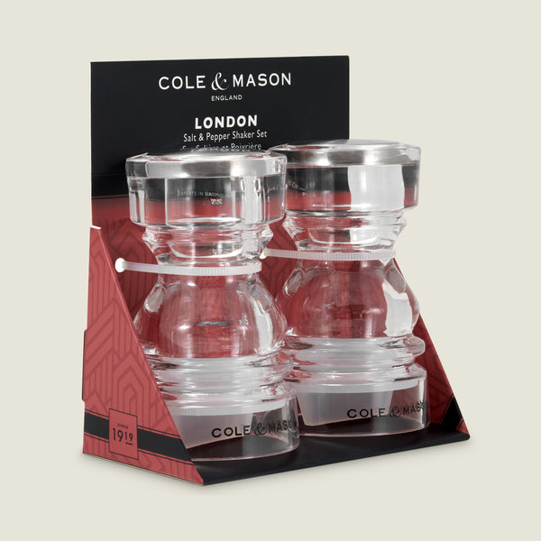 #86mm 
The Cole & Mason London Acrylic Salt & Pepper Shaker set features two clear shakers with silver lids in a chic red and black box—an elegant addition to any table setting.