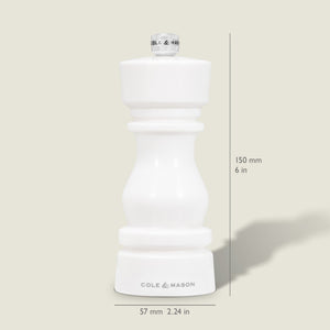 The Cole & Mason London White Acrylic Salt & Pepper Mill, measuring 150mm (6 in) tall and 57mm (2.24 in) wide, features an adjustable grinder—perfect for modern kitchens. Pictured upright on a light beige background.