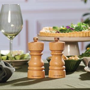 #130mm
Cole & Mason London beech mill set on a green-themed dining table