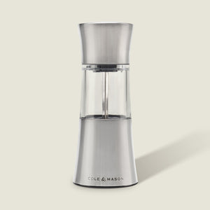 The Cole & Mason Stadhampton Chilli & Spice Mill features stainless steel and clear acrylic with an ergonomic design, COLE & MASON branding at the base, shown upright against a plain light background.
