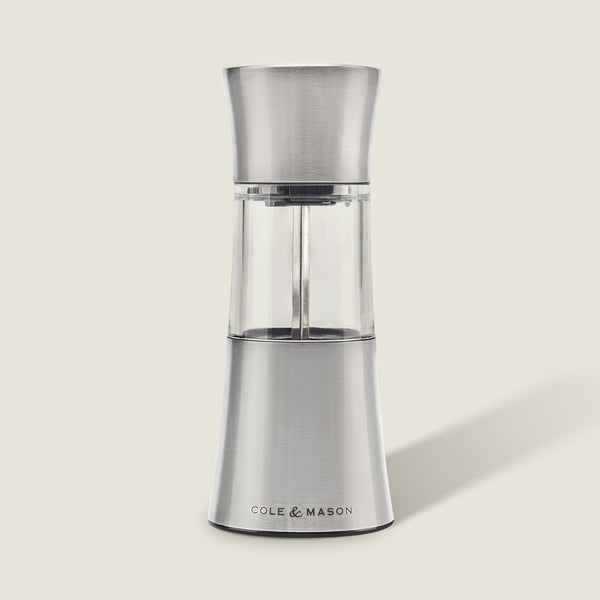 The Cole & Mason Stadhampton Chilli & Spice Mill features stainless steel and clear acrylic with an ergonomic design, COLE & MASON branding at the base, shown upright against a plain light background.